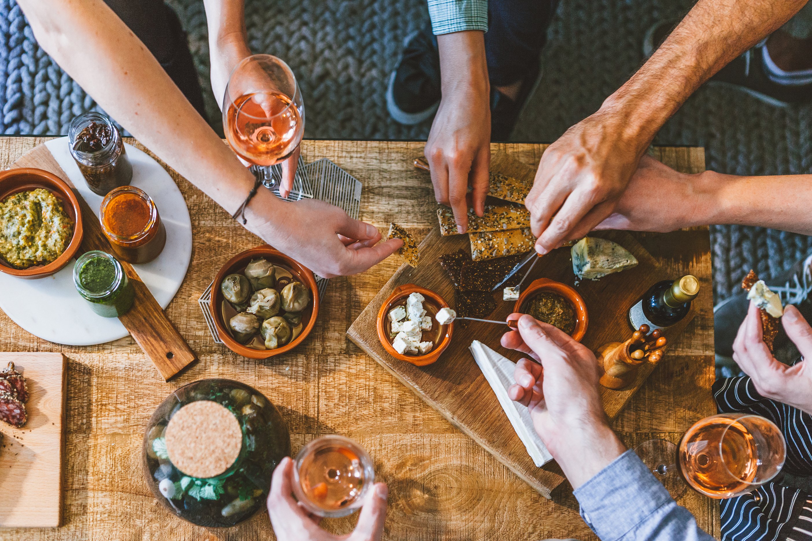 Friends Getting Finger Foods During a Party